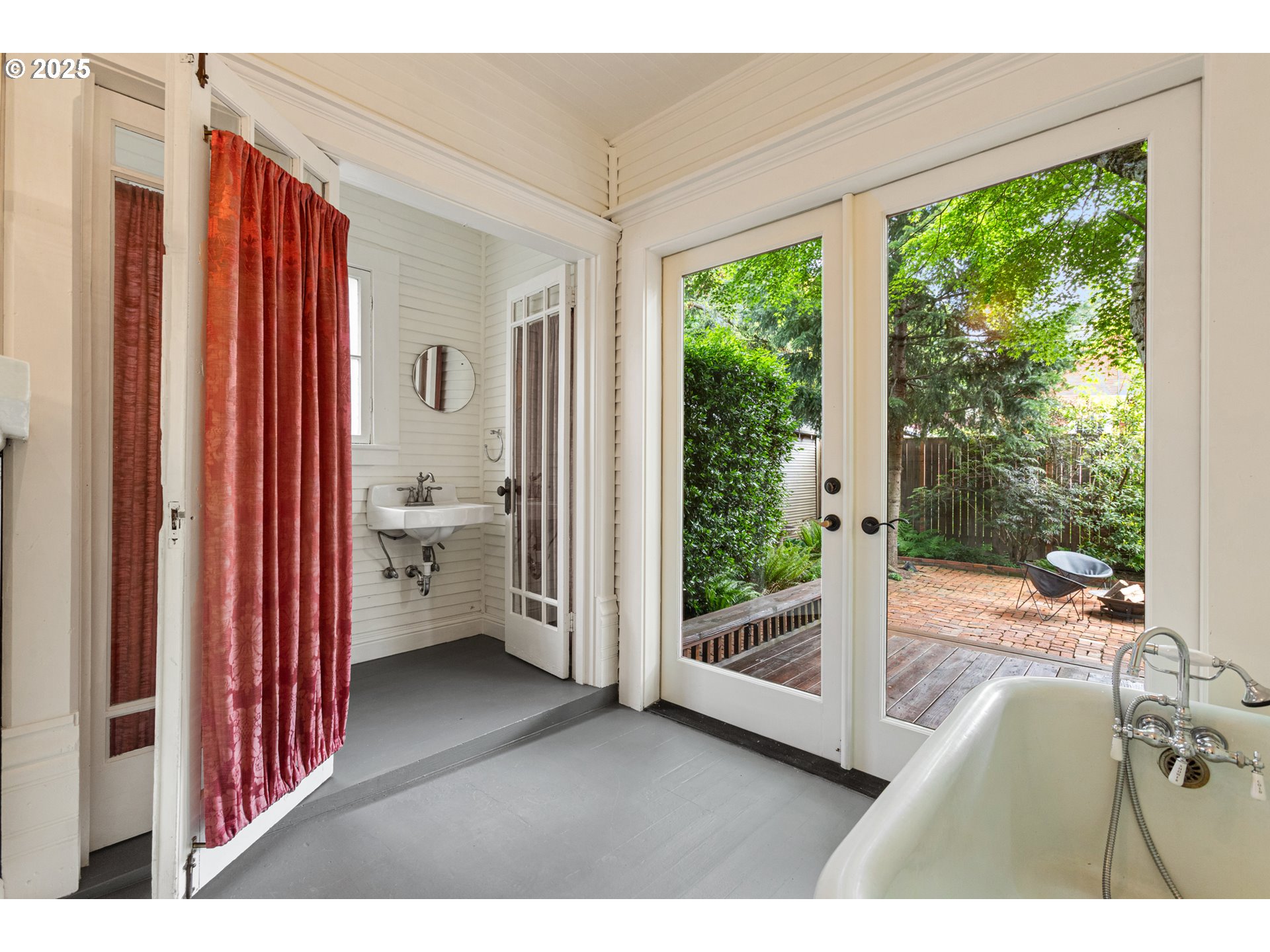 2404 Northeast 47th Avenue Portland, OR 97213 - Photo 16 of 35 a view of a bedroom with a bed and glass door