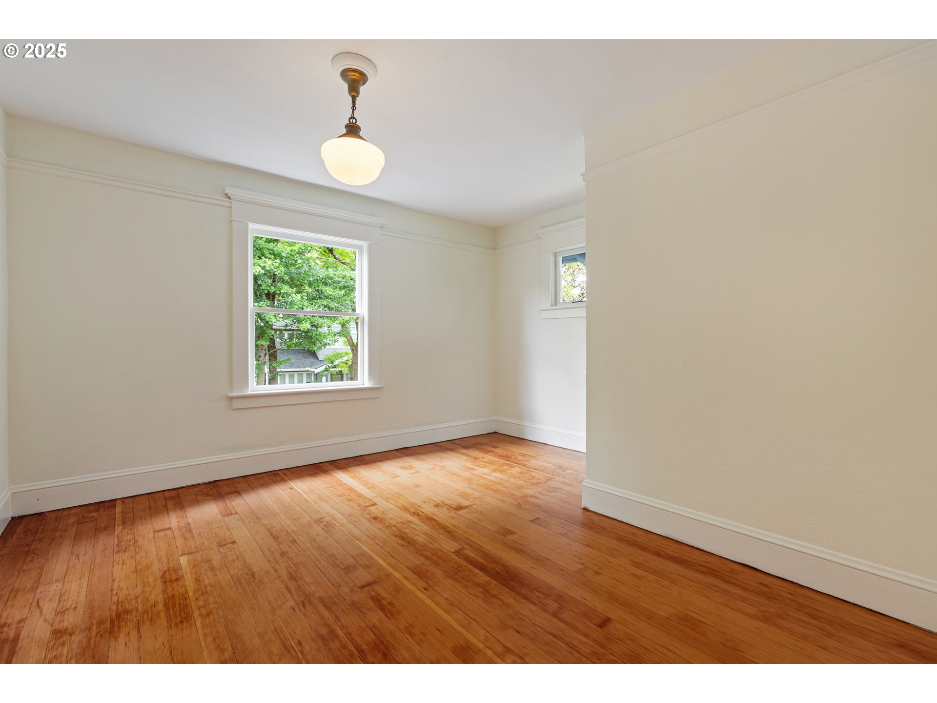 2404 Northeast 47th Avenue Portland, OR 97213 - Photo 17 of 35 an empty room with wooden floor and windows