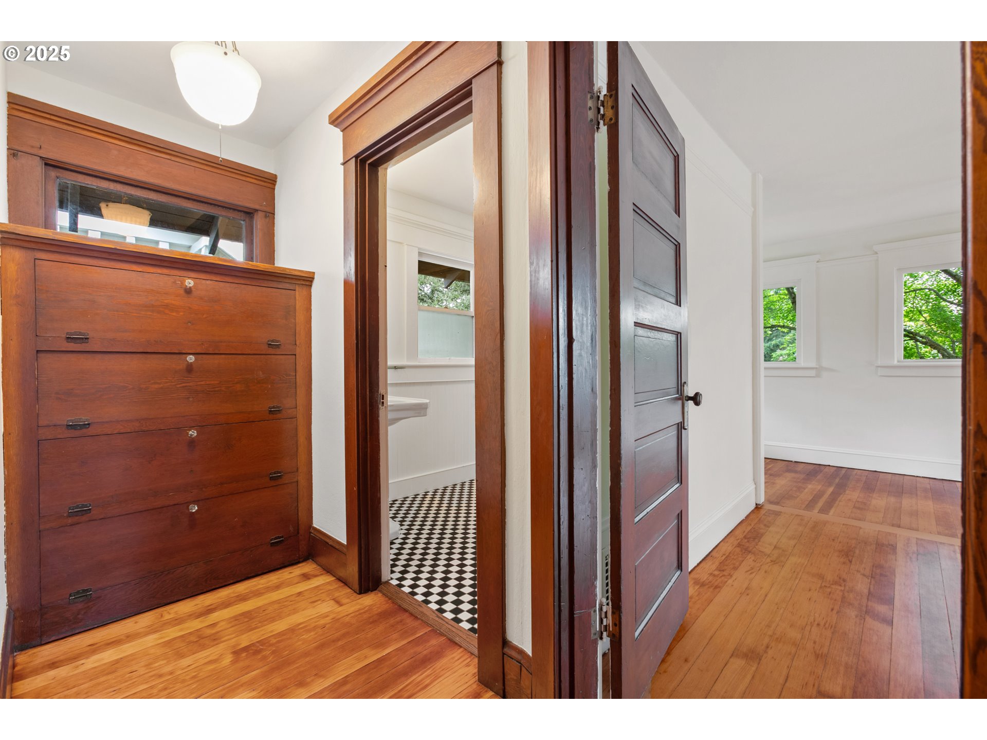 2404 Northeast 47th Avenue Portland, OR 97213 - Photo 19 of 35 a view of a hallway with wooden floor and windows