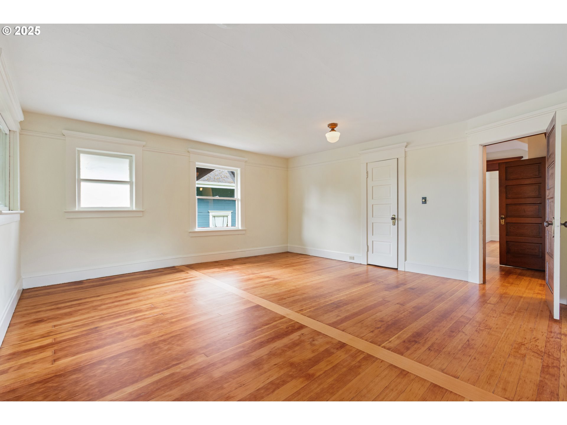 2404 Northeast 47th Avenue Portland, OR 97213 - Photo 21 of 35 a view of an empty room with wooden floor and a window