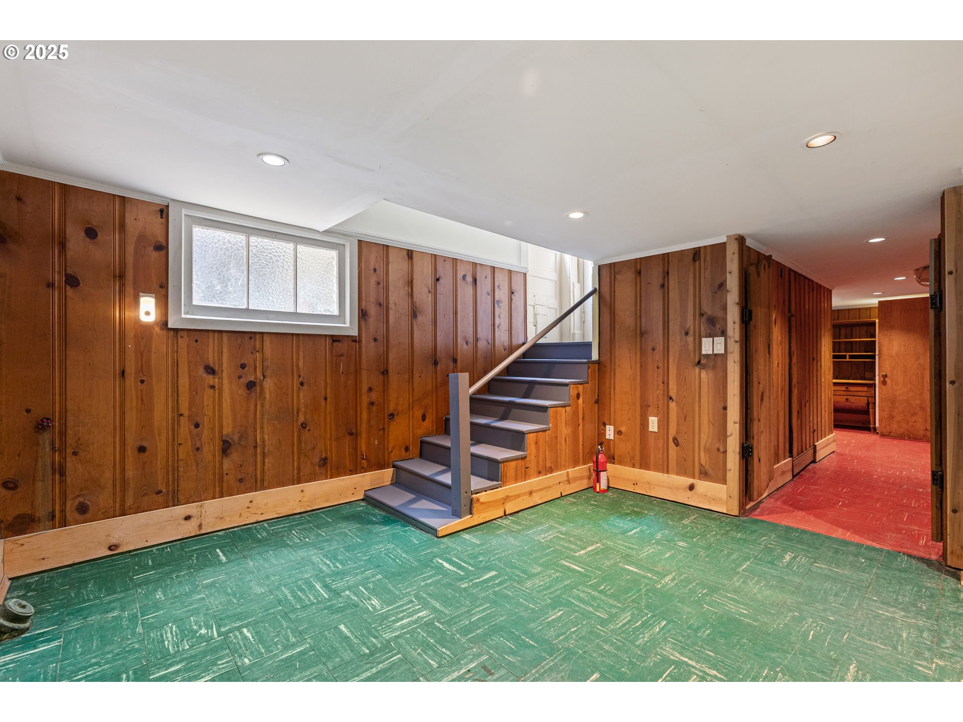 2404 Northeast 47th Avenue Portland, OR 97213 - Photo 26 of 35 a view of a bedroom with wooden floor stairs and windows