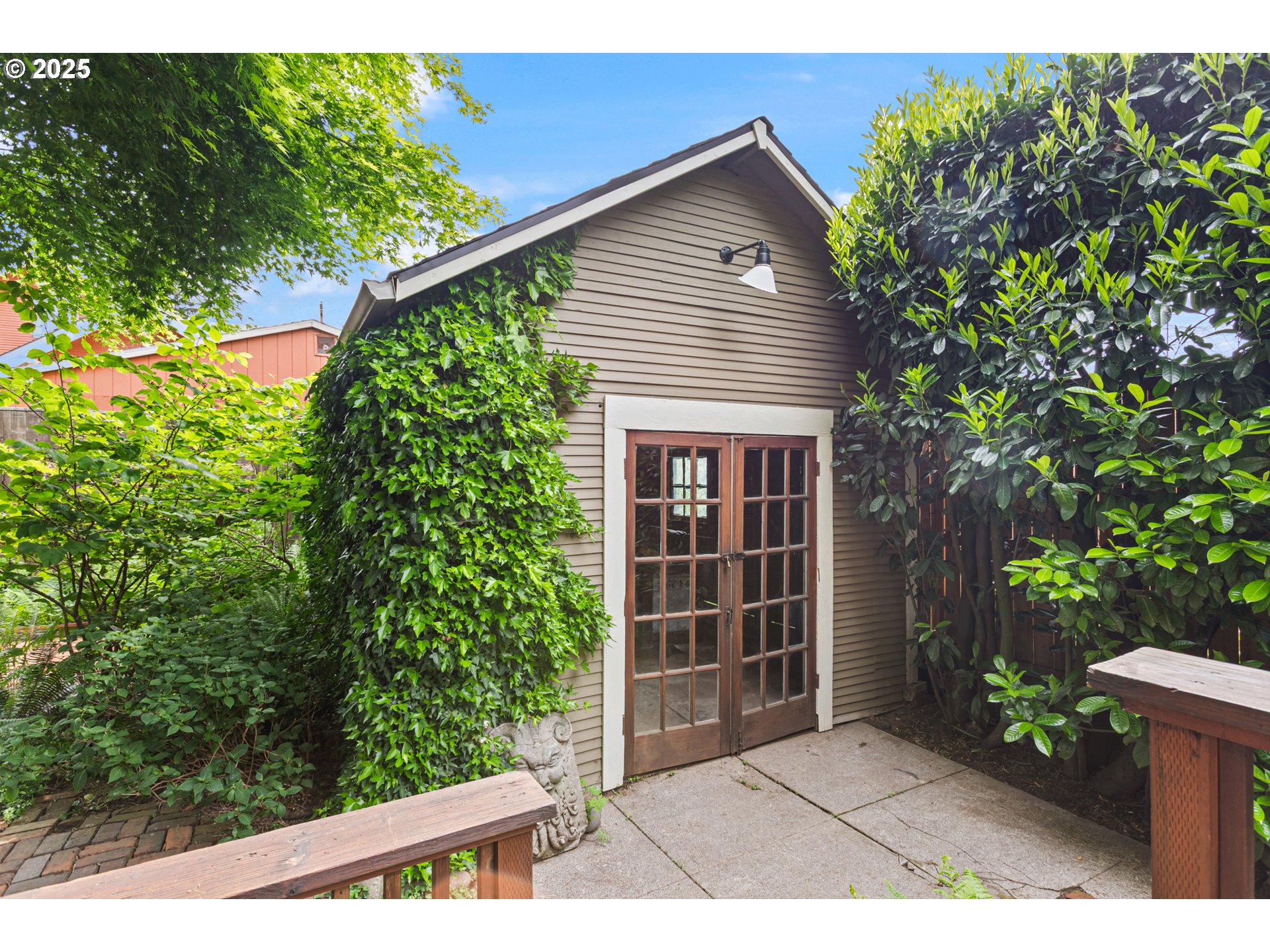 2404 Northeast 47th Avenue Portland, OR 97213 - Photo 31 of 35 a front view of a house with a garden