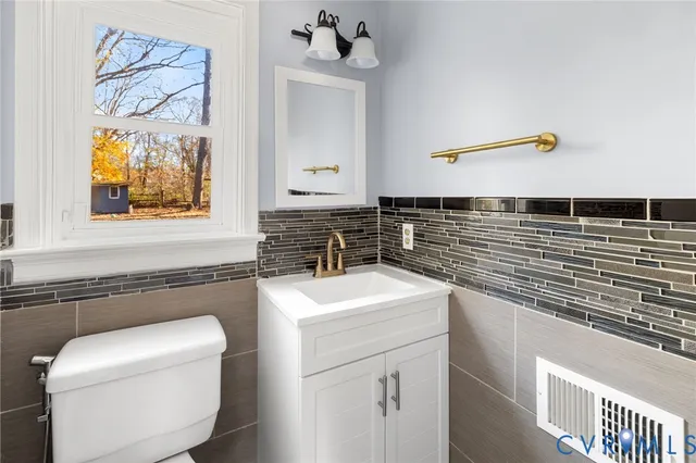 a kitchen with a sink and a stove top oven
