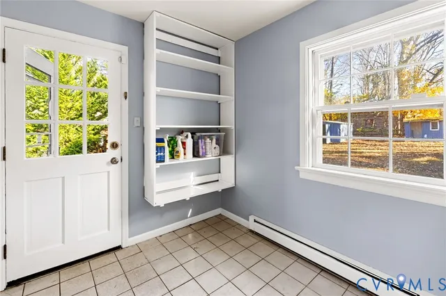 a view of room with window and furniture