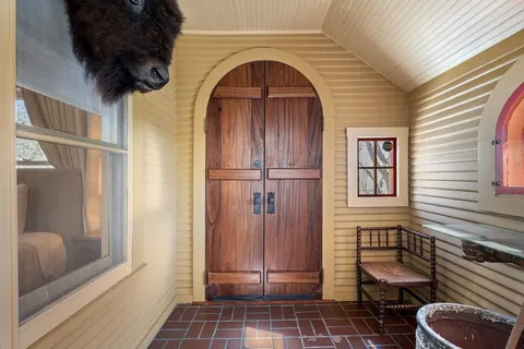 a view of a door and a window
