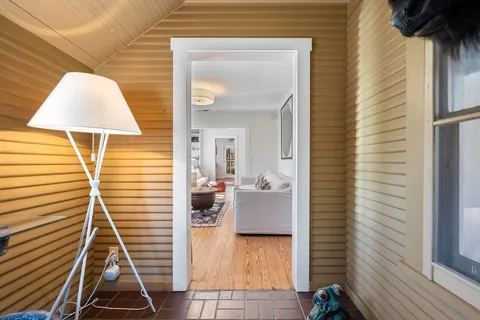 a view of living room and wooden floor