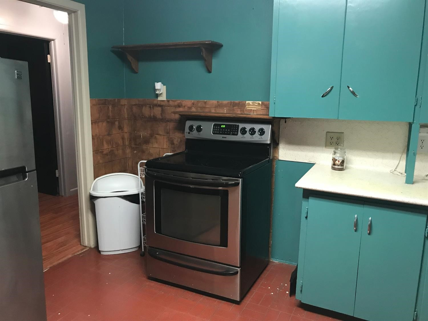 5509 43rd Street Lubbock, TX 79414 - Photo 2 of 10 a stove top oven sitting inside of a kitchen