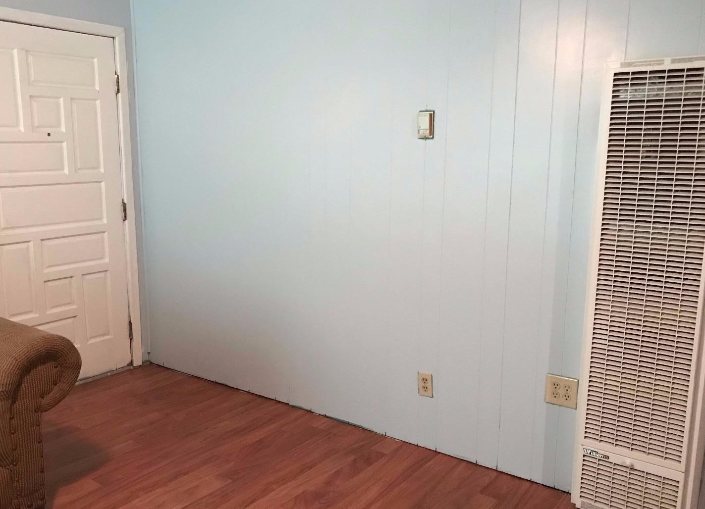 5509 43rd Street Lubbock, TX 79414 - Photo 7 of 10 a view of a bedroom with wooden floor