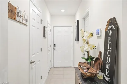 a entryway with furniture and a potted plant