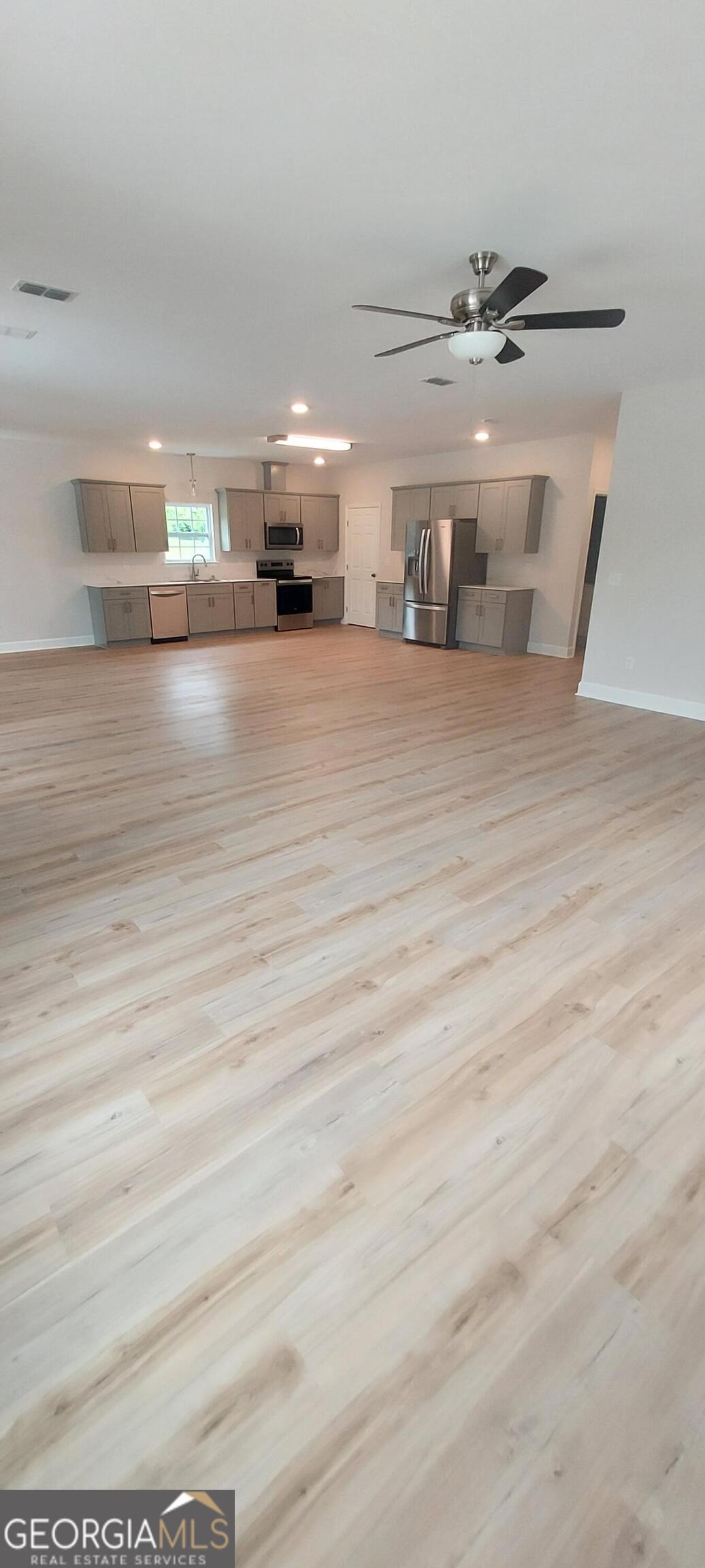 415 Charles Street Bainbridge, GA 39819 - Photo 3 of 9 a view of a room with gym equipment