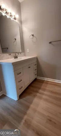 a bathroom with a double vanity sink and mirror