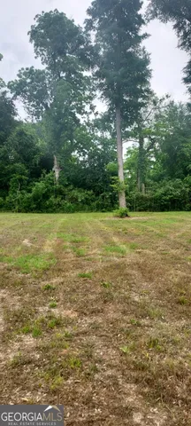 a view of a field with an outdoor space