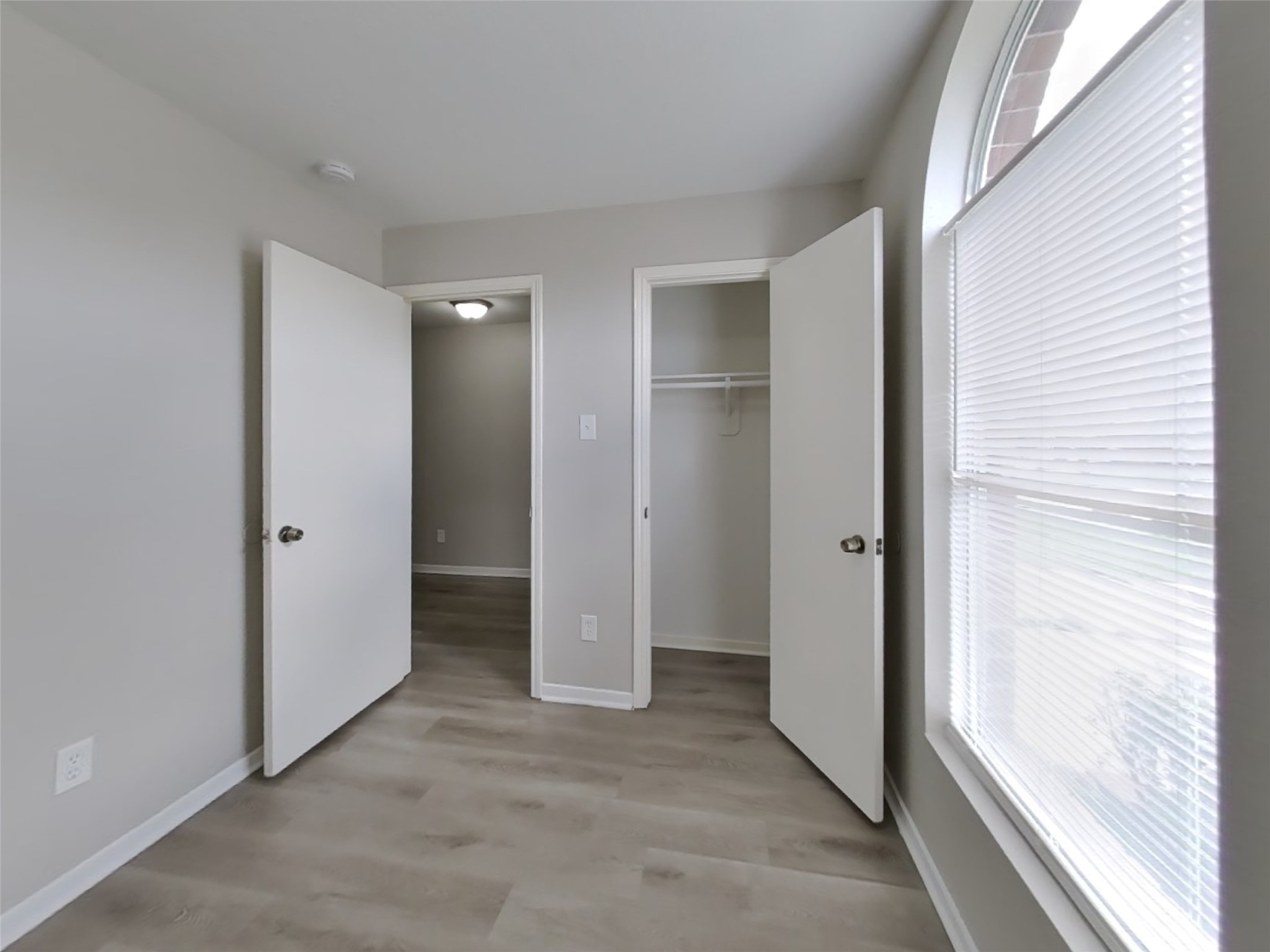 15019 Easingwold Drive Channelview, TX 77530 - Photo 12 of 17 an empty room with closet and windows