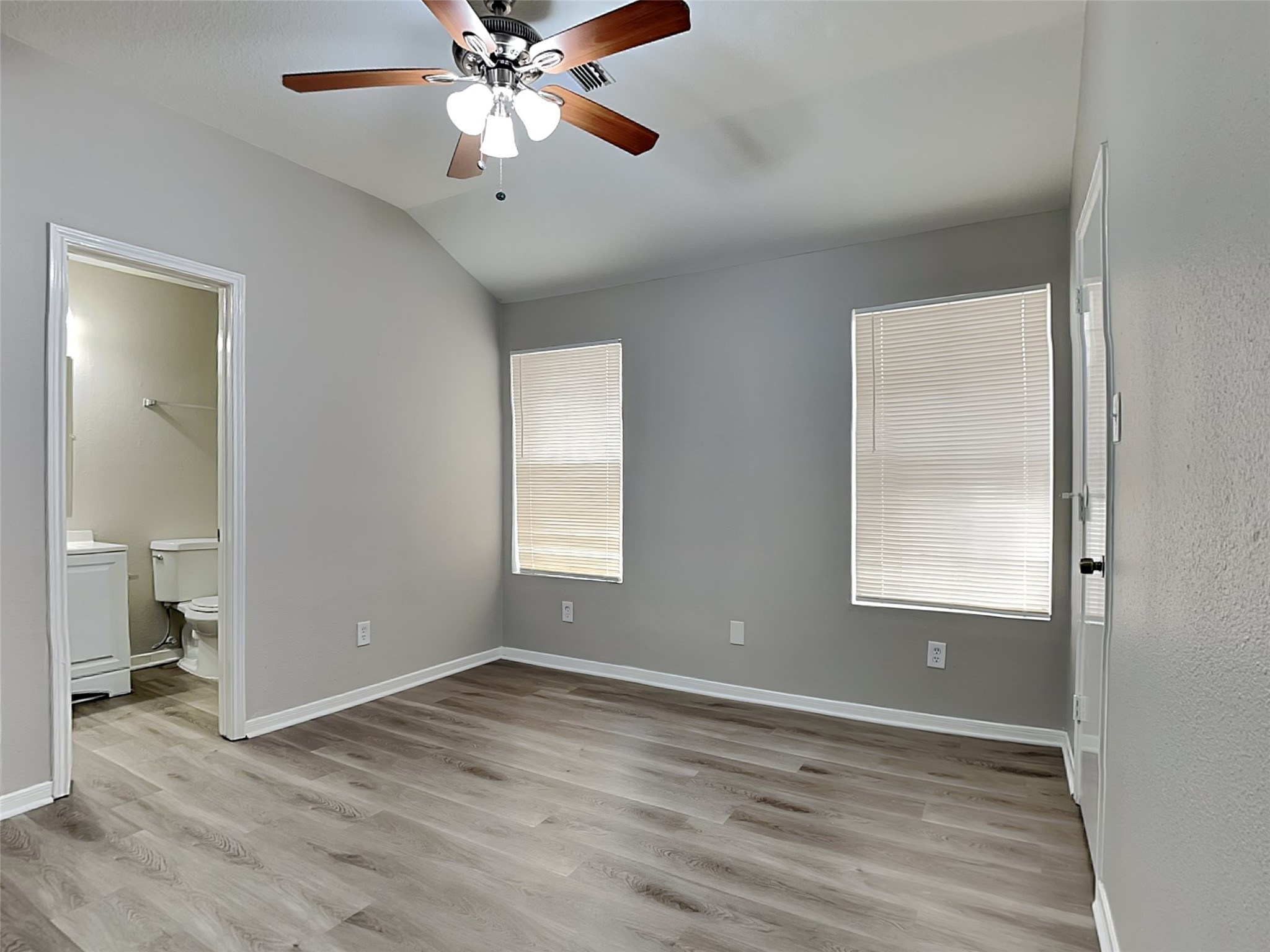 15019 Easingwold Drive Channelview, TX 77530 - Photo 14 of 17 a view of an empty room with wooden floor and a window
