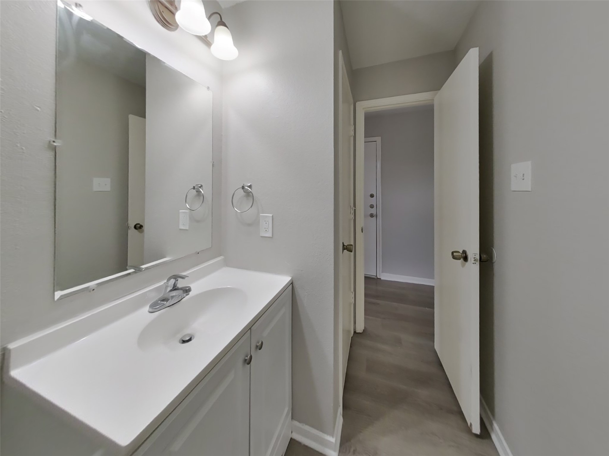 15019 Easingwold Drive Channelview, TX 77530 - Photo 16 of 17 a spacious bathroom with a sink and mirror