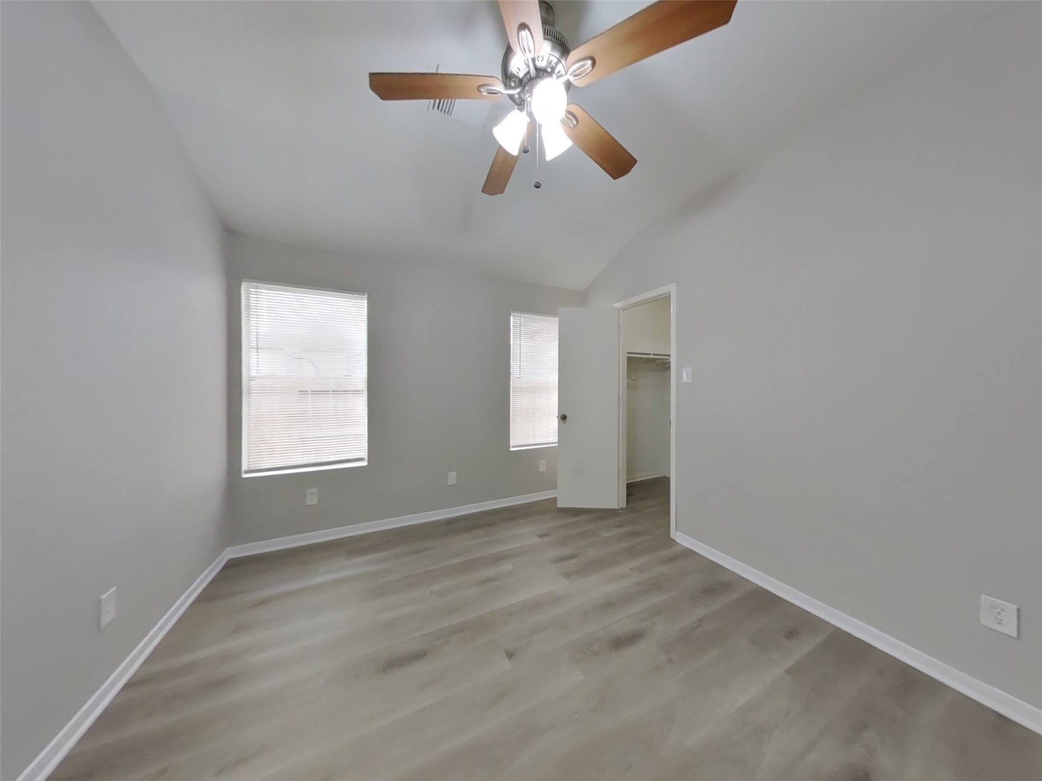 15019 Easingwold Drive Channelview, TX 77530 - Photo 8 of 17 an empty room with fan and windows