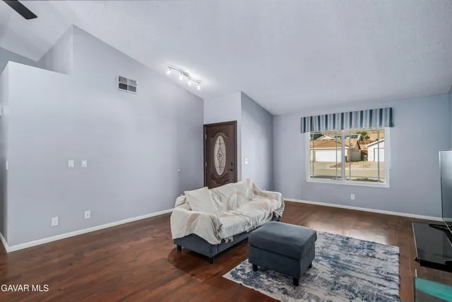 a bed room with furniture and a window