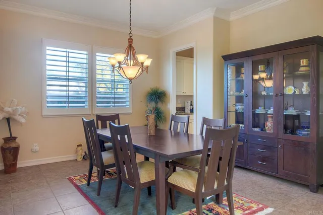a view of a dining room with furniture and window