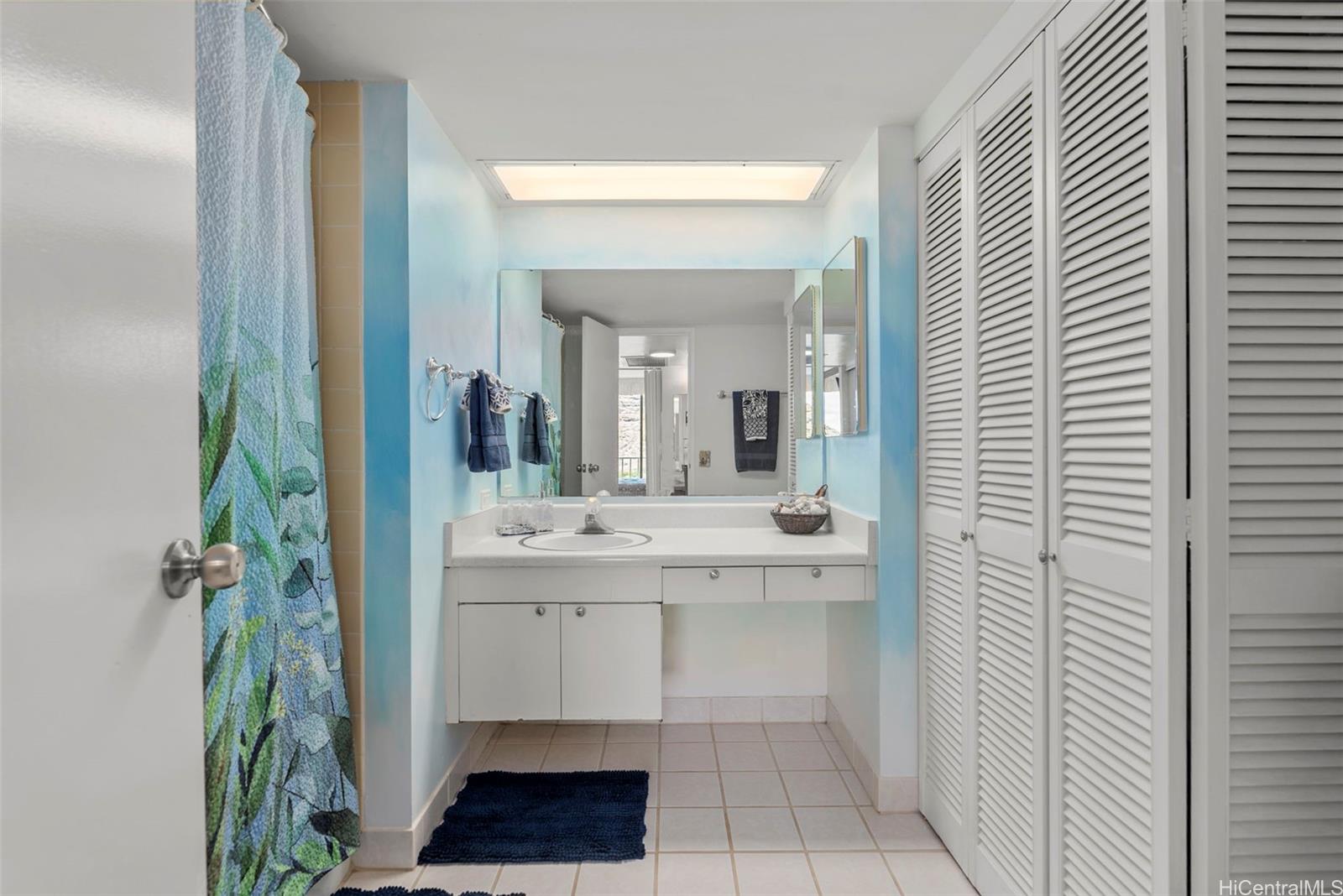 84-680 Kili Drive, Unit C1210 Waianae, HI 96792 - Photo 20 of 24 a en suite bathroom with a sink and a mirror