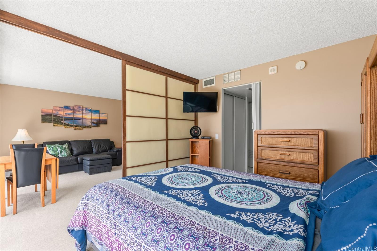 84-680 Kili Drive, Unit C1210 Waianae, HI 96792 - Photo 6 of 24 a bedroom with a bed and cabinets