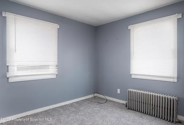 a view of a room with drop ceiling