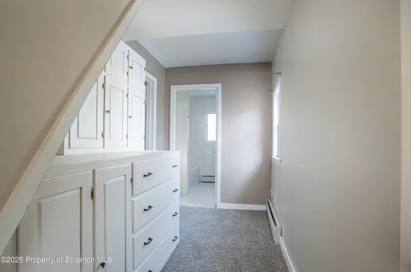 a bathroom with a bathtub and shower
