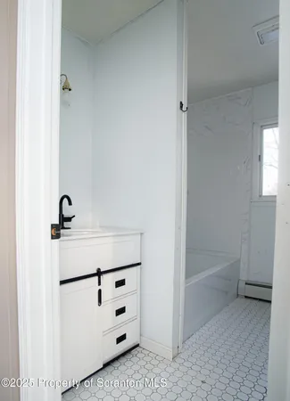 a utility room with closet dryer and washer