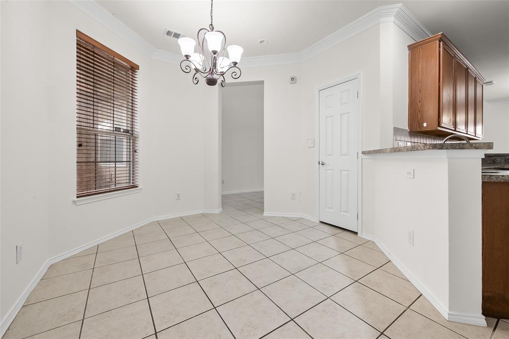 8524 Heather Ridge Drive Plano, TX 75024 - Photo 12 of 27 a view of a livingroom with a chandelier