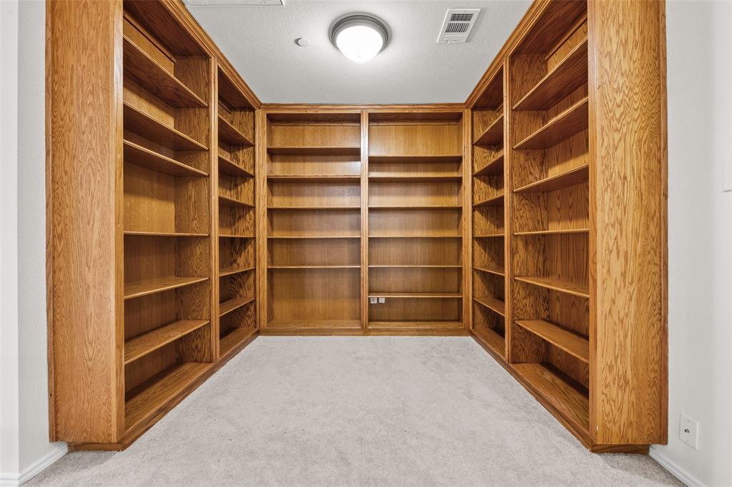 8524 Heather Ridge Drive Plano, TX 75024 - Photo 20 of 27 a view of an empty room with empty shelves