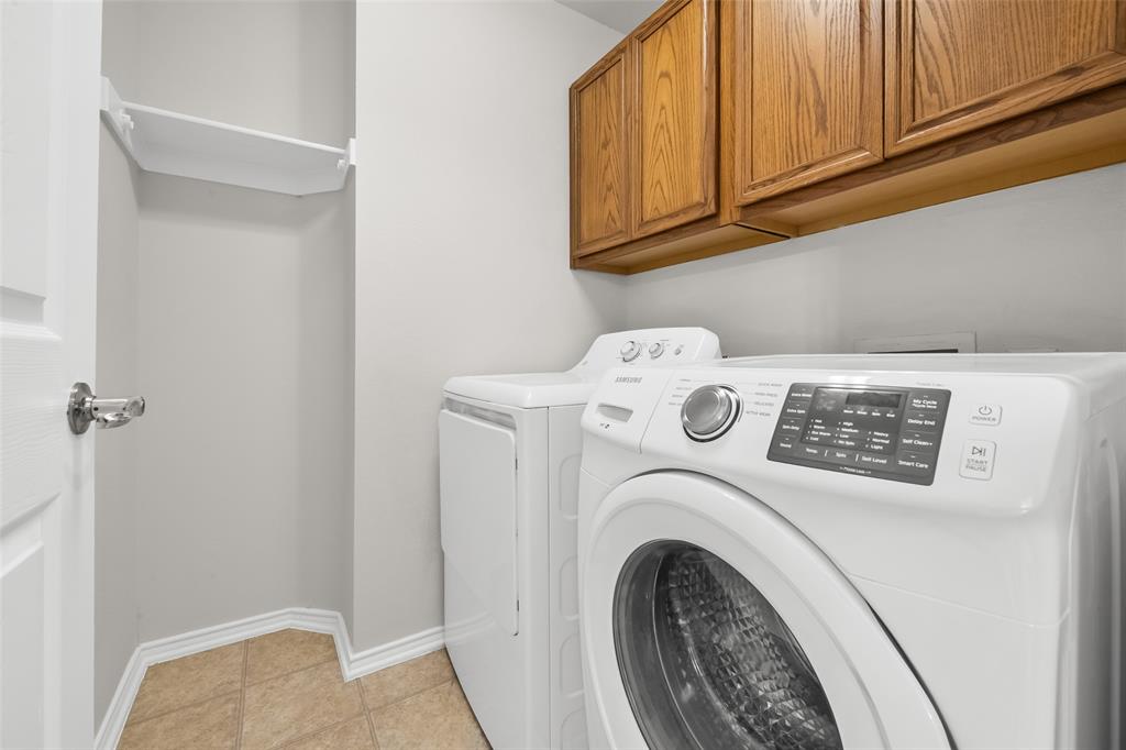 8524 Heather Ridge Drive Plano, TX 75024 - Photo 21 of 27 a utility room with dryer and washer