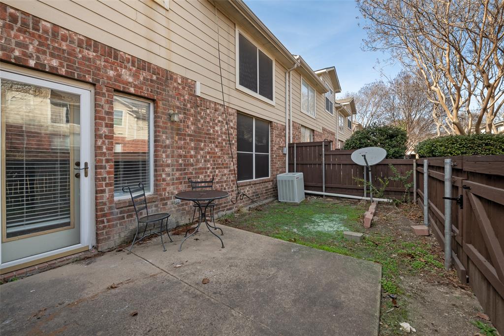 8524 Heather Ridge Drive Plano, TX 75024 - Photo 22 of 27 a backyard of a house with table and chairs