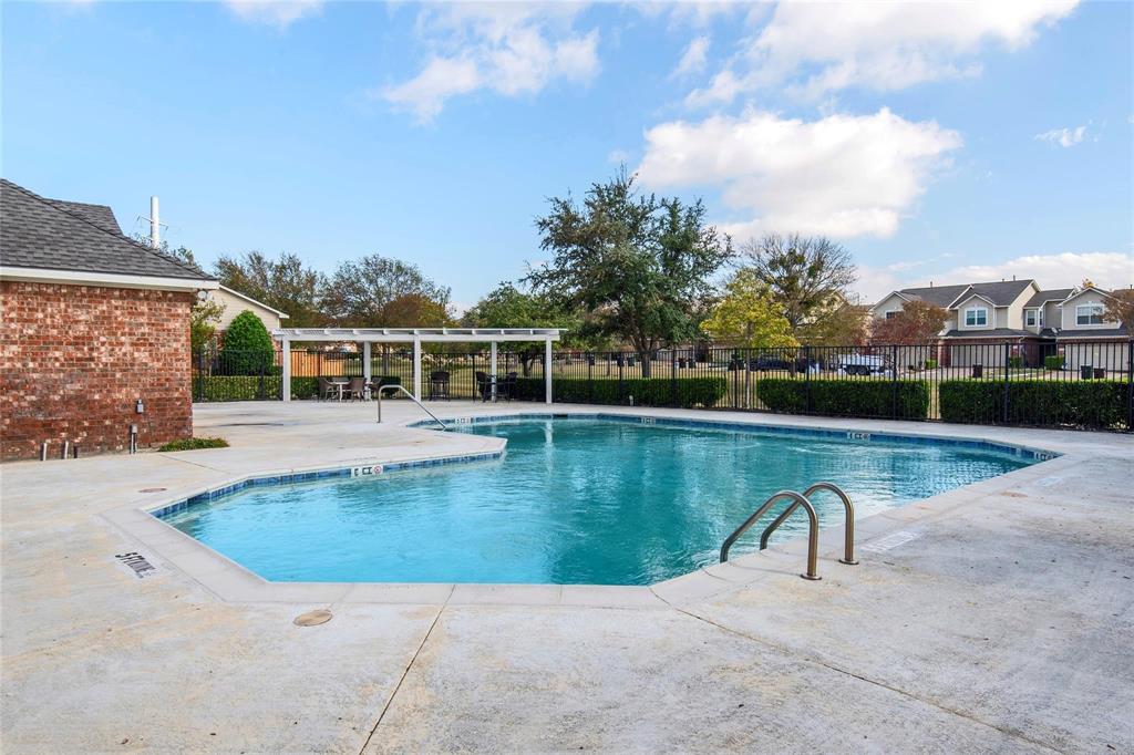 8524 Heather Ridge Drive Plano, TX 75024 - Photo 26 of 27 a view of a swimming pool with a yard