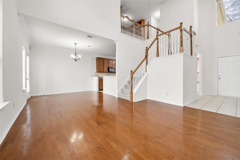 8524 Heather Ridge Drive Plano, TX 75024 - Photo 6 of 27 a view of an entryway with wooden floor