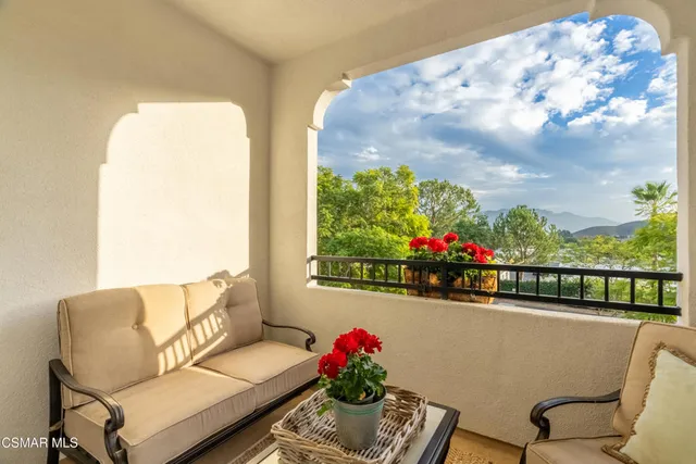 a picture of a couch in a balcony