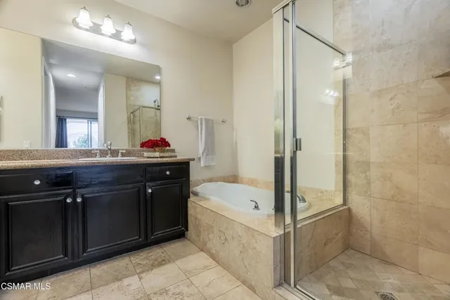 a bathroom with a bathtub and a sink