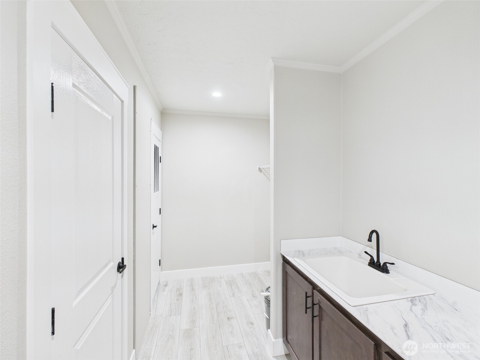 720 South Jefferson Street Republic, WA 99166 - Photo 19 of 27 a bathroom with a granite countertop sink and a mirror