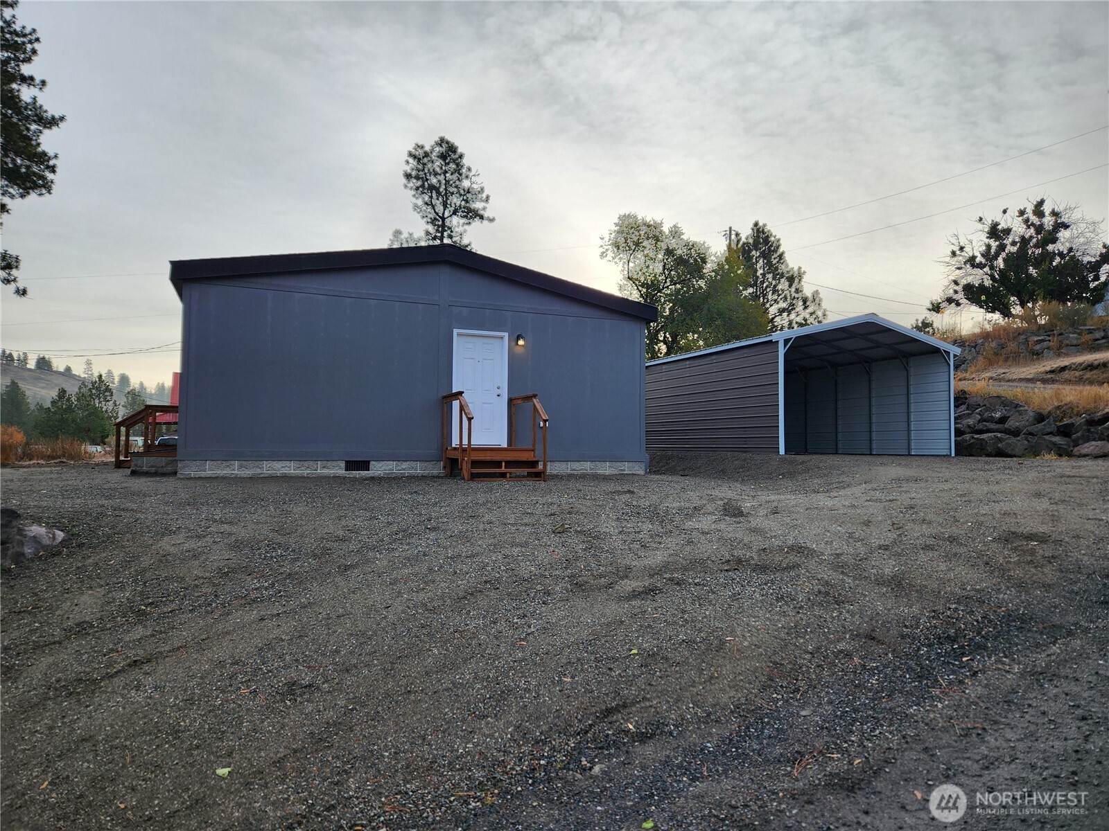 720 South Jefferson Street Republic, WA 99166 - Photo 21 of 27 a backyard of a house with lots of green space