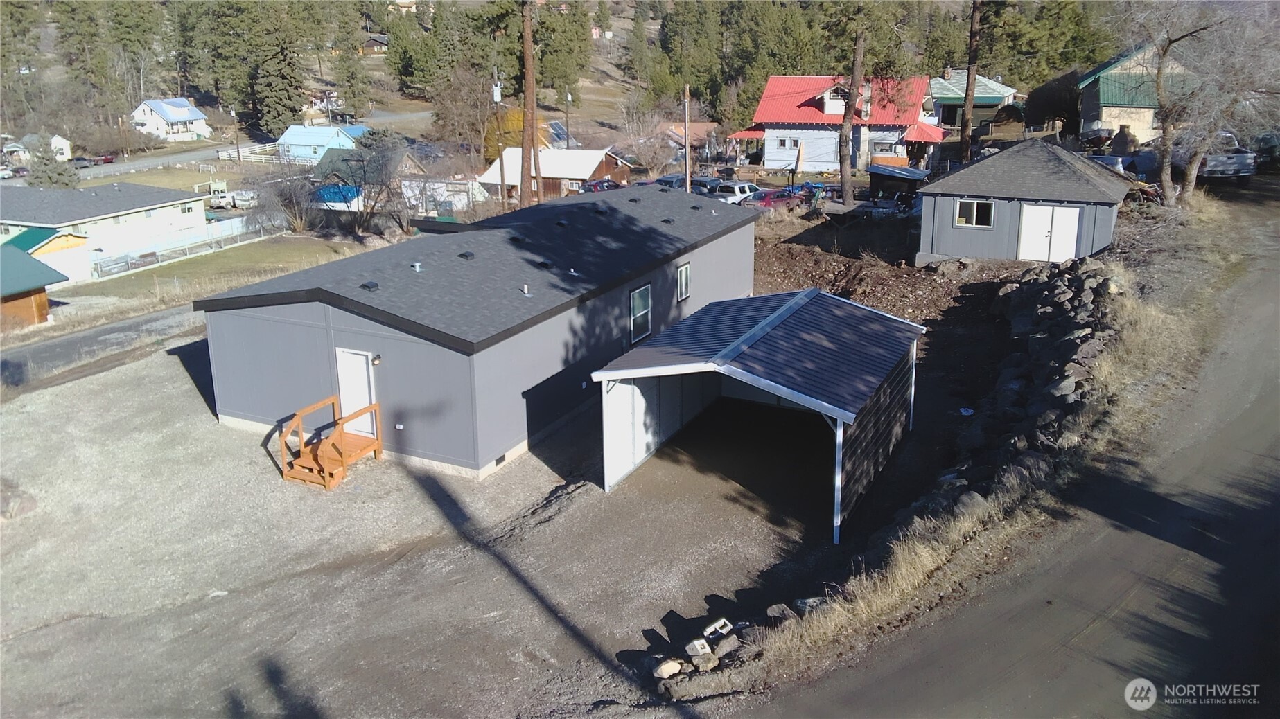 720 South Jefferson Street Republic, WA 99166 - Photo 5 of 27 an aerial view of a house with a yard fire pit and outdoor seating