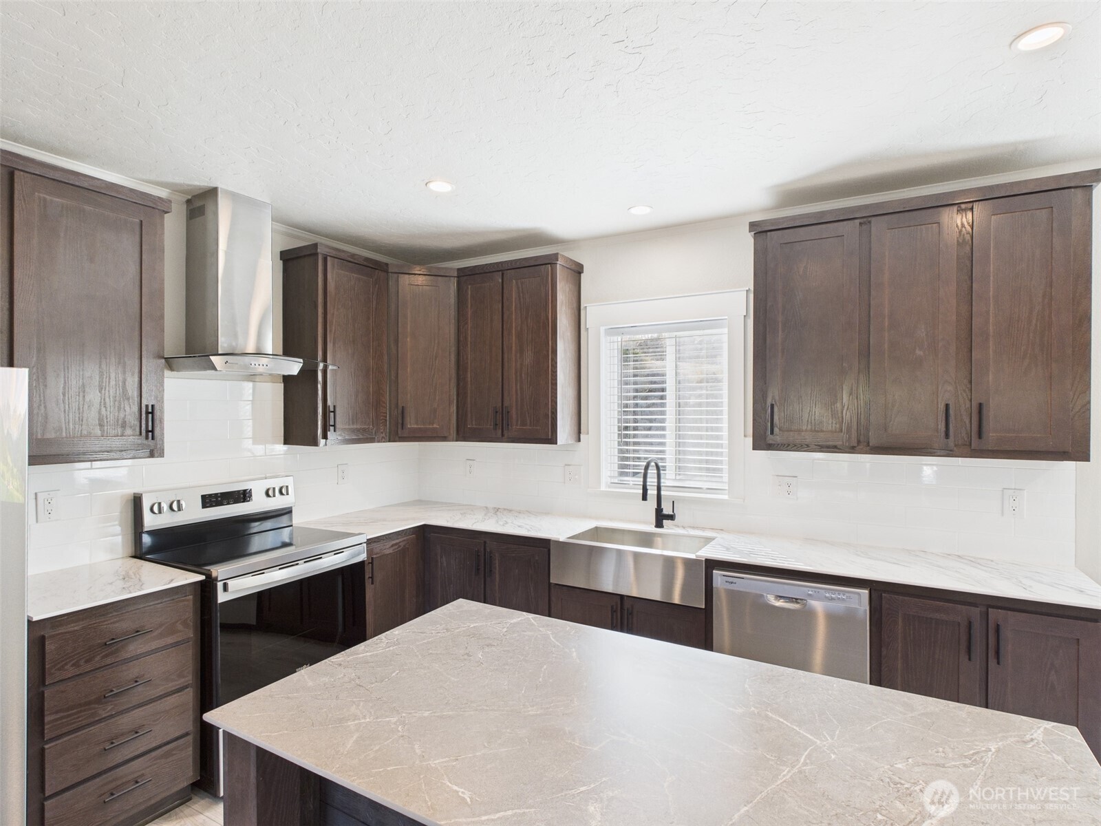 720 South Jefferson Street Republic, WA 99166 - Photo 9 of 27 a kitchen with a sink a stove and cabinets