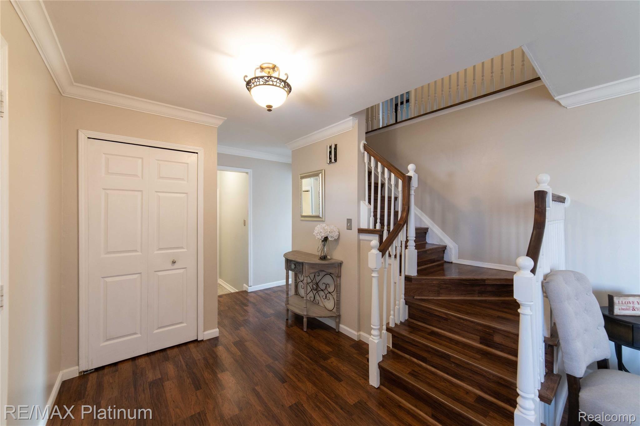 42289 Hanford Road Canton, MI 48187 - Photo 5 of 29 coat closet & doorway to lav & laundry