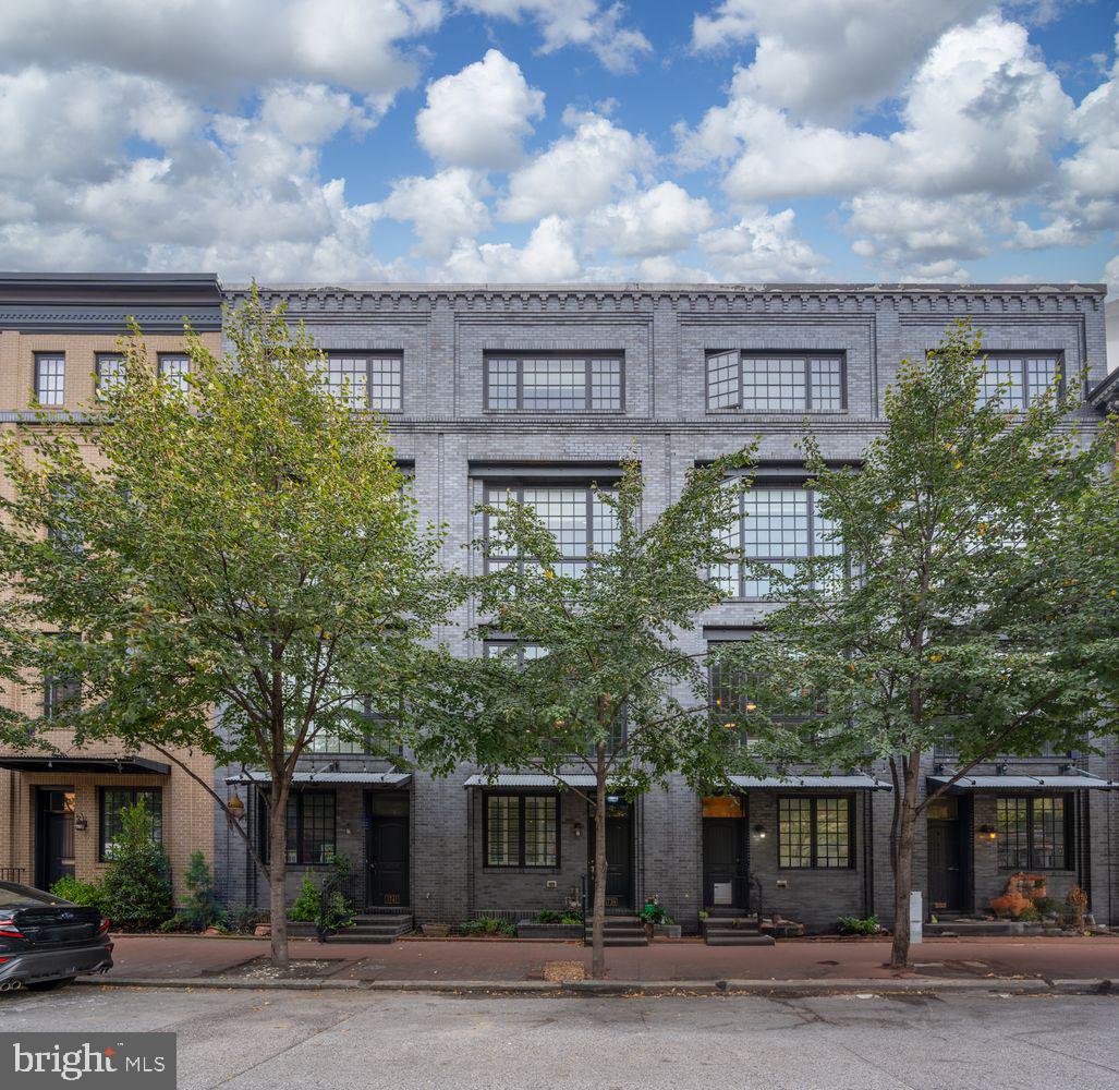 a large building with a tree in front of it