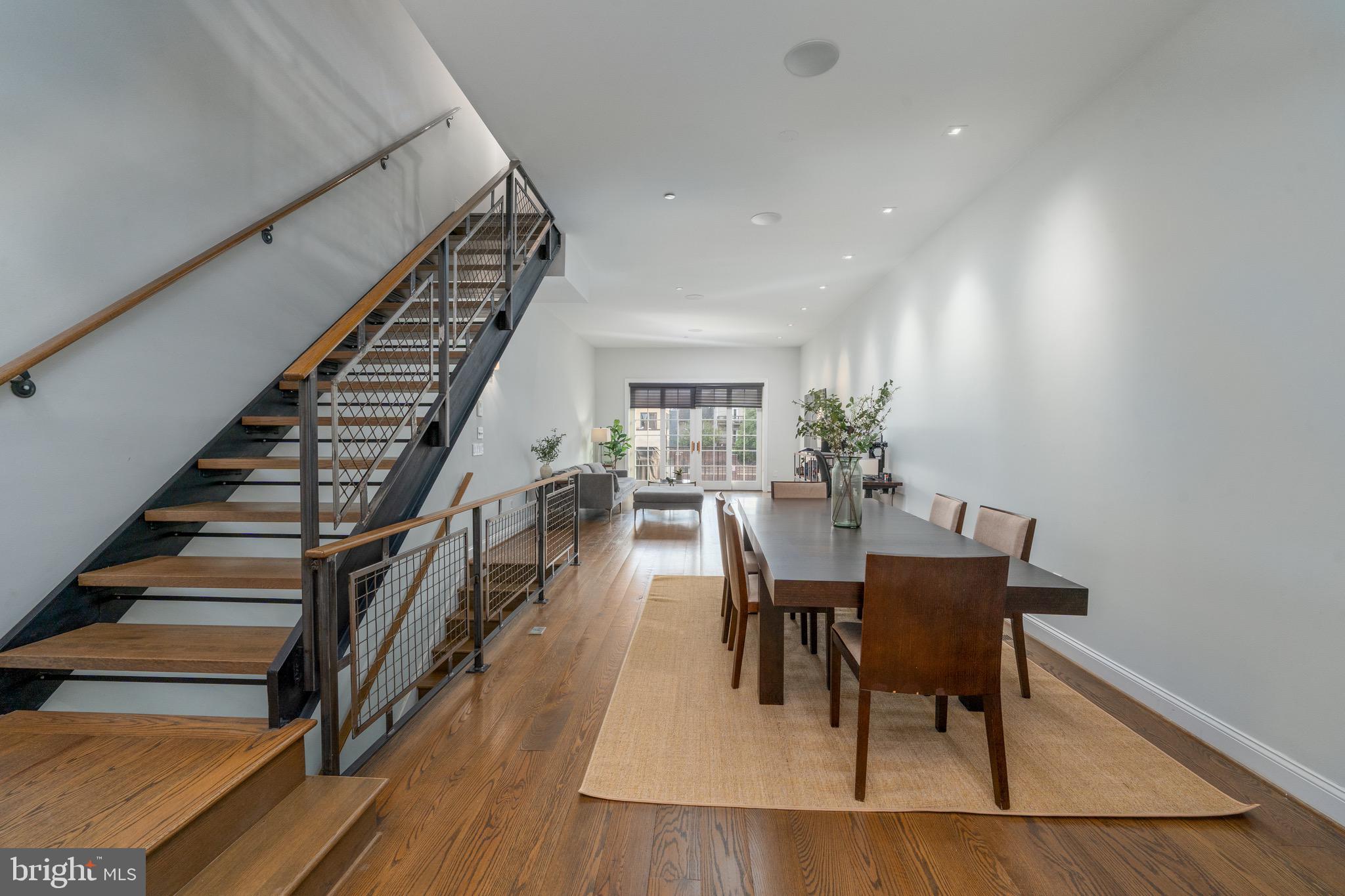 1735 Aliceanna Street Baltimore, MD 21231 - Photo 11 of 48 a dining room with furniture entryway and wooden floor