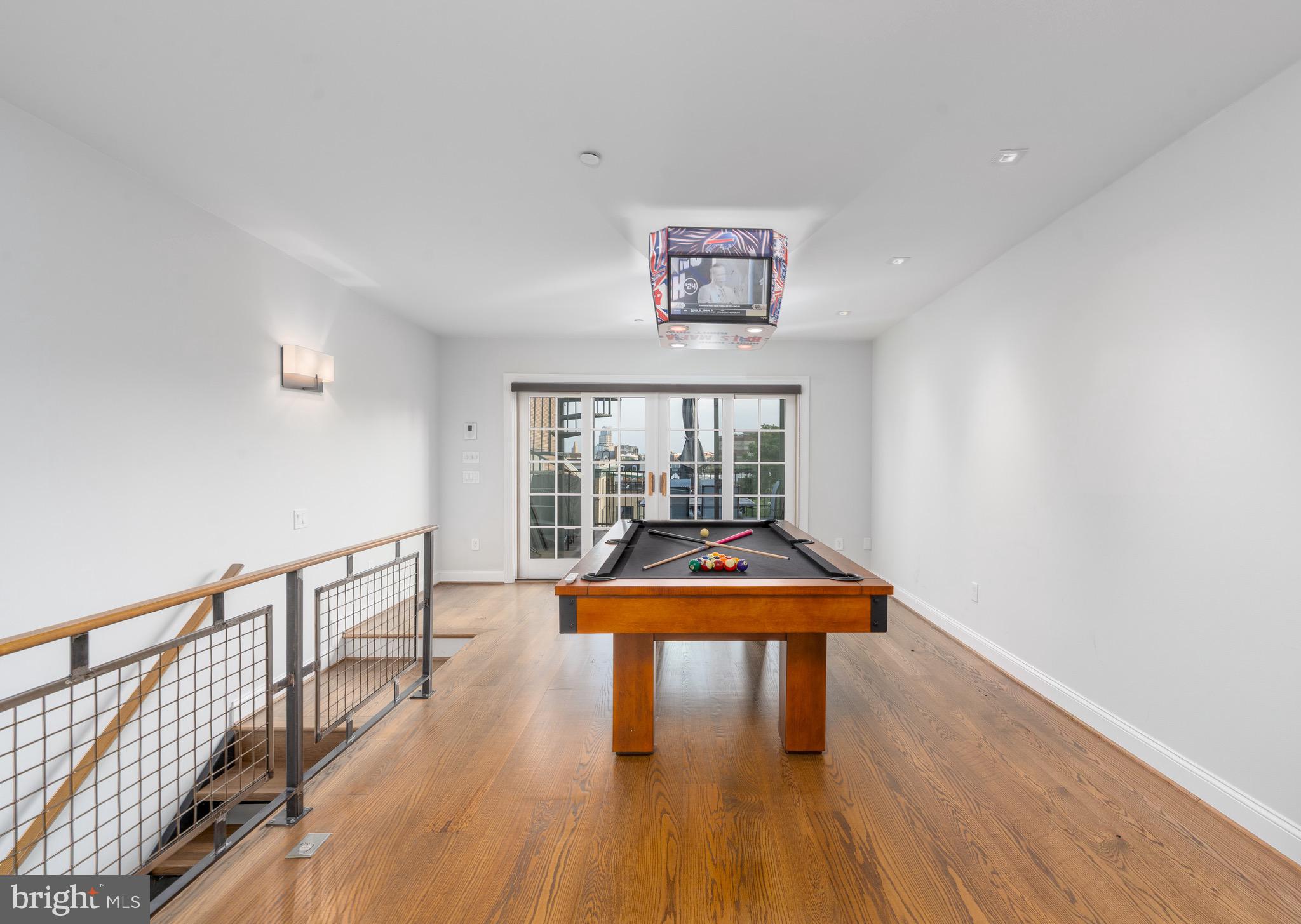 1735 Aliceanna Street Baltimore, MD 21231 - Photo 20 of 48 a room with furniture and wooden floor