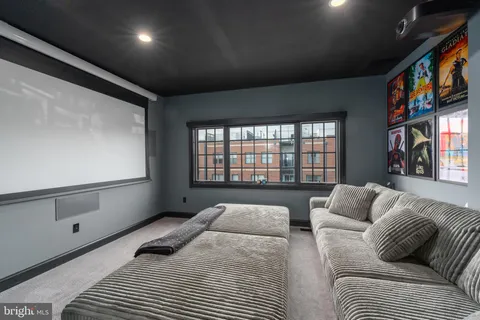 a bedroom with two beds and a large window