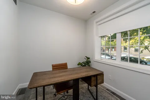 a workspace with furniture and window