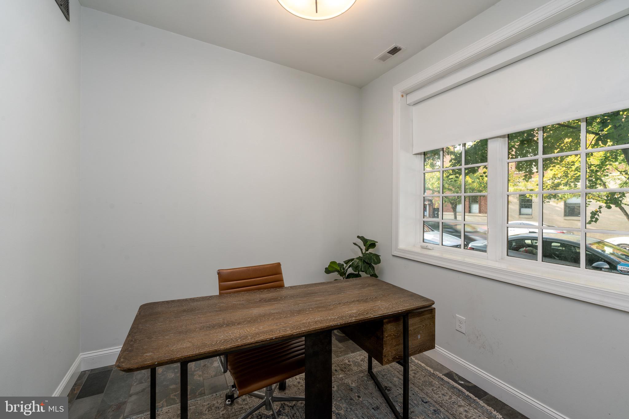 1735 Aliceanna Street Baltimore, MD 21231 - Photo 23 of 48 a workspace with furniture and window