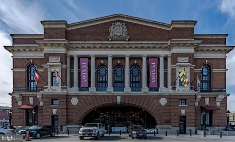 a view of swimming pool with outdoor seating