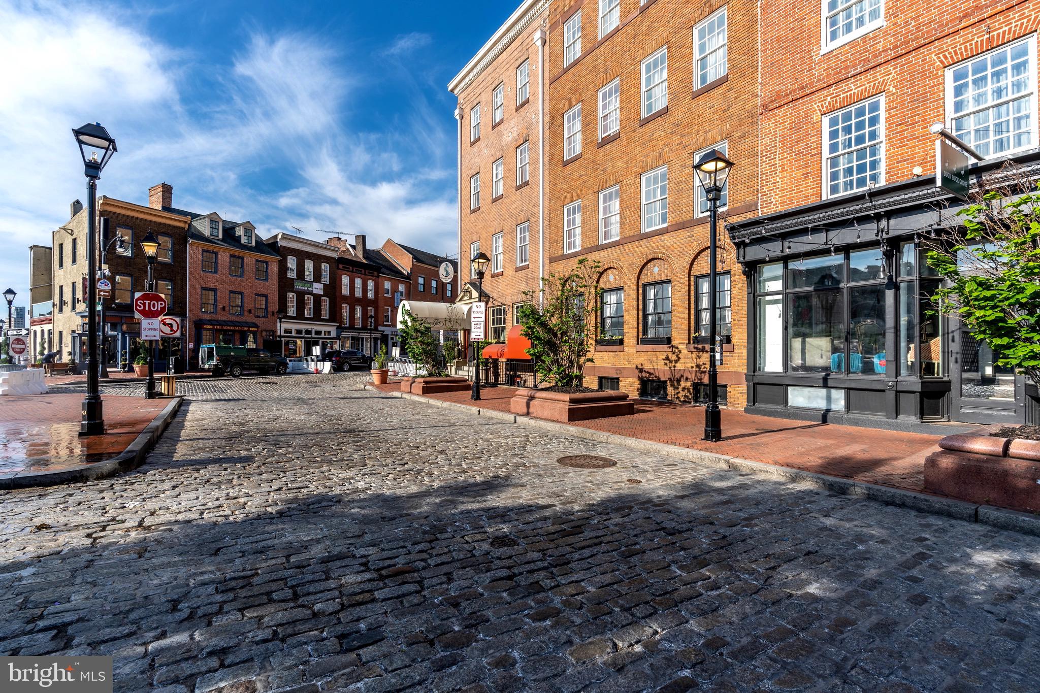 1735 Aliceanna Street Baltimore, MD 21231 - Photo 40 of 48 a street view of a building with many windows