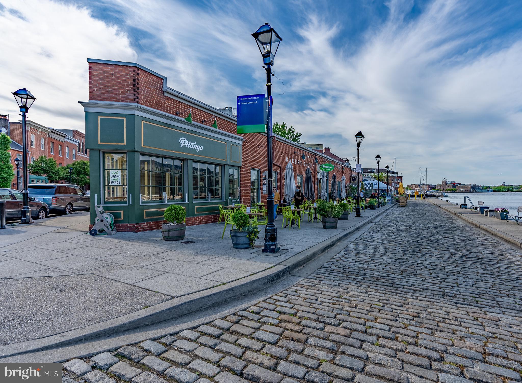1735 Aliceanna Street Baltimore, MD 21231 - Photo 44 of 48 a view of a street with cars parked