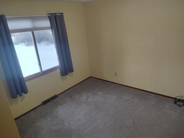 an empty room with window